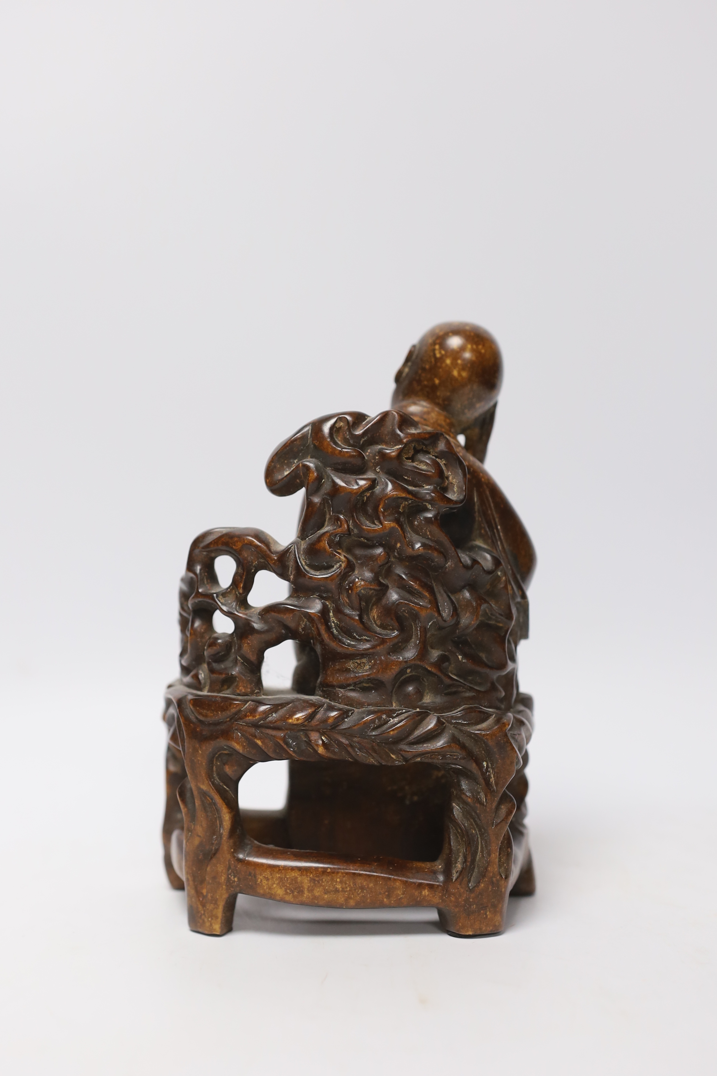 A Chinese carved wood figure of a scholar, 19cm